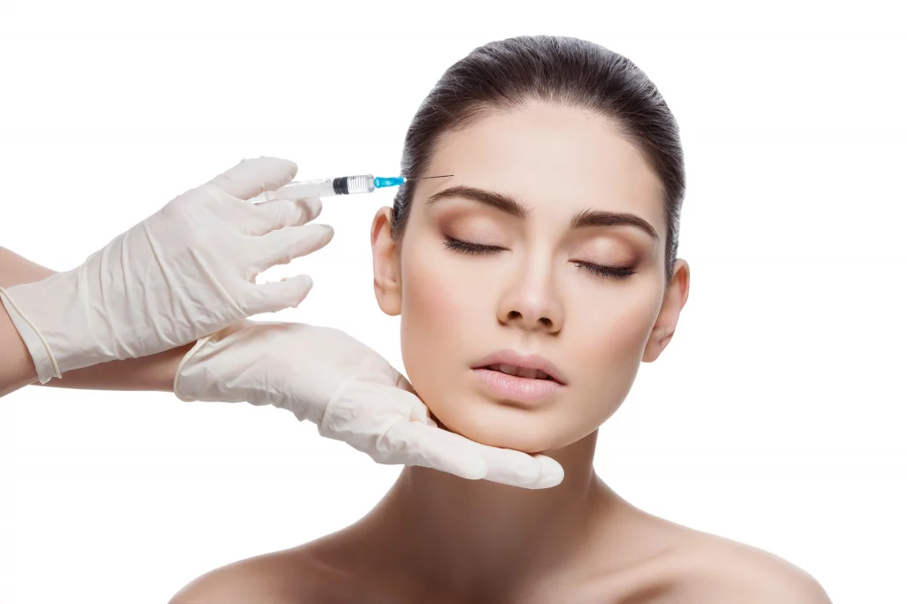 Woman receiving Botox injection from doctor for facial rejuvenation treatment